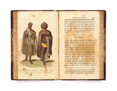 an open book with a picture of two men in traditional clothing