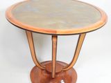 a small table with a marble top on a pedestal