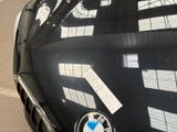 a bmw emblem on the hood of a black car