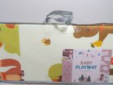 a baby play mat with a picture of a bear and other animals