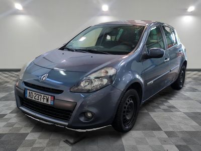 a picture of a small blue car parked in a garage