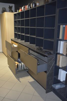 a kitchen that has a lot of shelves and cabinets in it