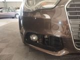 a close up of a car ' s front bumper and grille