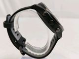 the back of a watch on a clear plastic stand