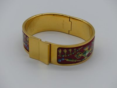 HERMES: bracelet Clic Clac en métal doré à décor en émail ro…