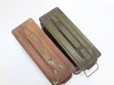 two old suitcases that are sitting on a white surface