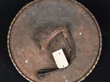 an image of an old hat with a tag on it