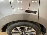 a close up of a car ' s tire with a sticker on it