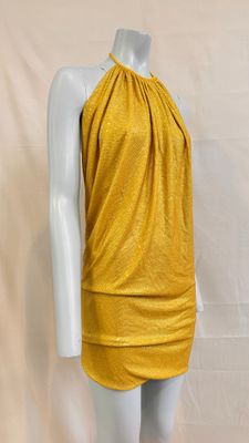 the mannequin is wearing a yellow dress with a halt
