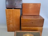three wooden boxes are stacked on top of each other on a table