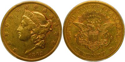 a close up of two gold coins with a woman ' s head
