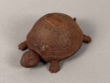 a small turtle that is sitting on a table