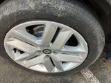 a close up of a tire on the side of a car