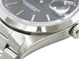 a close up of a watch with a black dial