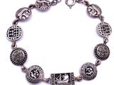 a close up of a bracelet on a white background