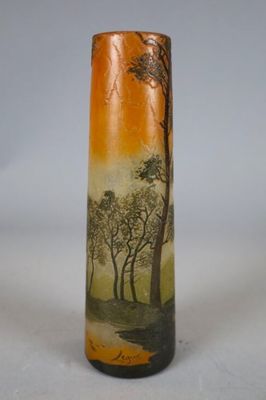 a vase with a painting on it sitting on a table