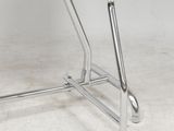 an image of a chrome steel desk with a glass top