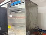 a metal oven sitting on a pallet in a room