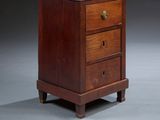 a small wooden cabinet with a mirror on top of it