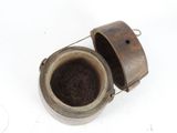 a small metal pot with a handle on a white surface