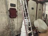 a ladder that is leaning against a wall in a room