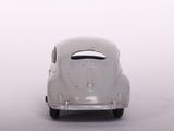 a toy car that is sitting on a white surface