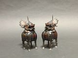 pair of antique silver plated figurines of two dogs with horns