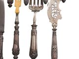 many different types of silverware on a white background