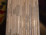 a lot of books on a table with a price tag