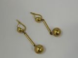 pair of gold plated earrings on a white background