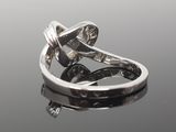 an image of a diamond ring on a reflective surface