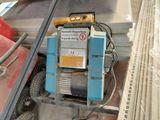 a machine that is sitting on the back of a truck