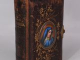 a small book with a picture of a woman on it