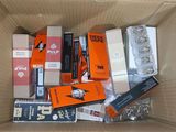 a cardboard box filled with assorted electronic devices