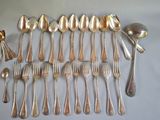 a lot of silver spoons and spoon spoons on the table