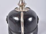 an image of a black and silver helmet on a white background