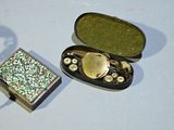 a small box that has some kind of jewelry inside of it
