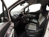 the interior of a car with the door open and the driver ' s seat down