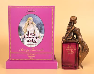 a bottle of perfume sitting next to a statue of a woman