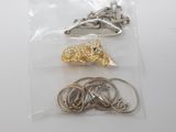 three different types of hair clips in a bag