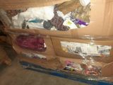 a large cardboard box with many items inside of it
