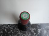 a bottle of wine that is sitting on a counter