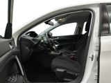 the interior of a car with the door open and the driver ' s seat down