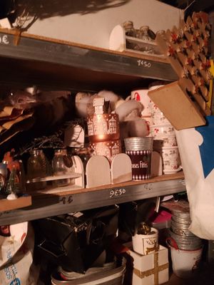 a lot of clutter on the shelves in the room