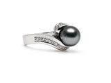 an image of a black pearl and diamond ring on a white background