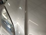 a close up of a car ' s headlight and front bumper