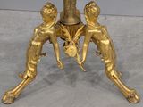 a gold table with a clock on top of it