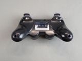 a close up of a video game controller on a table