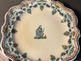 a plate with a picture of a man on it on a table