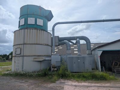 a large machine that is sitting outside of a building